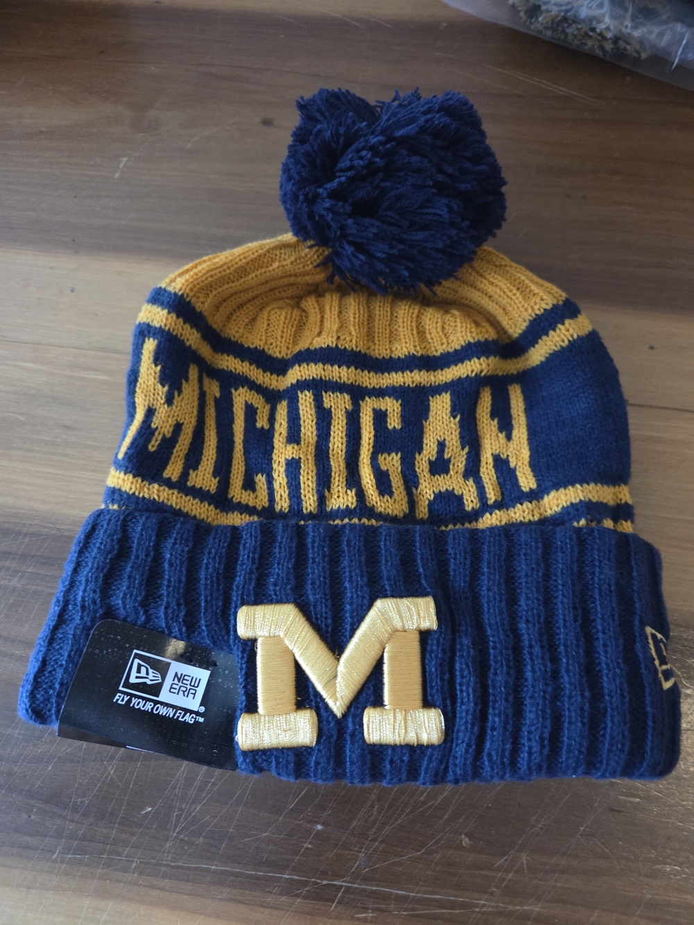 New Era Kids Michigan Pom Beanie in Navy and Maize